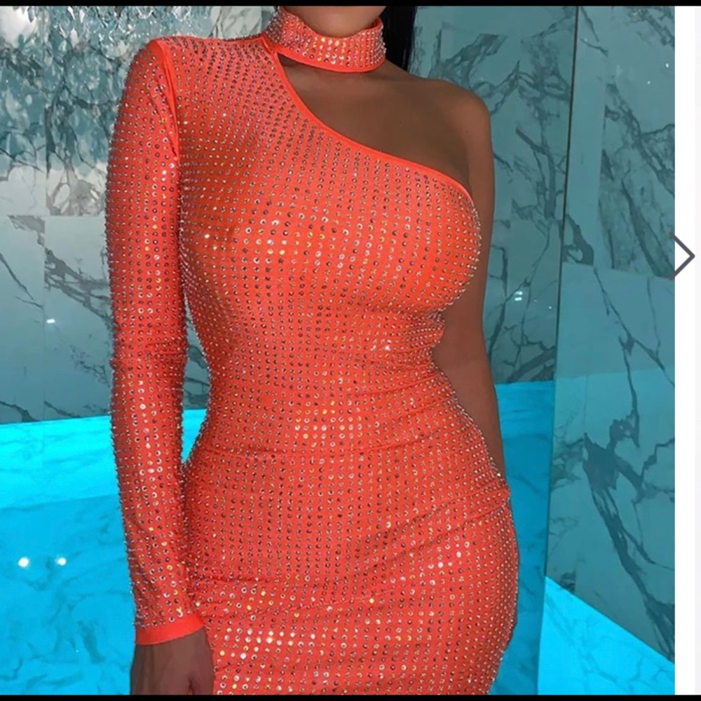 Show stopping orange one shoulder dress. Brand new